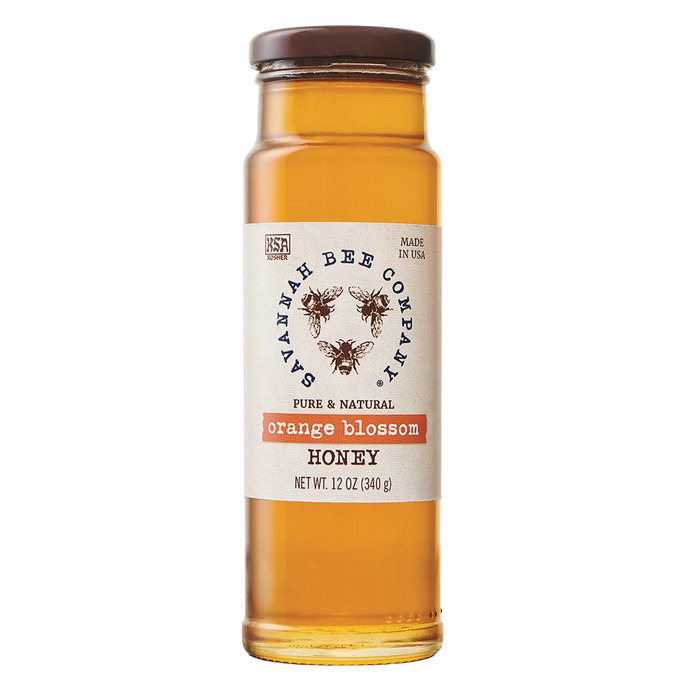 Handcrafted amber orange blossom honey in a clear glass jar with a brown lid, part of Kitchen & Food, Food, Pantry, Best Sellers, and Promo Eligible collections.