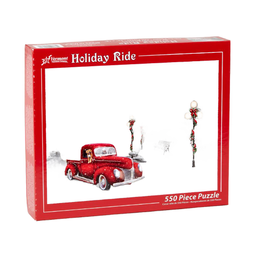 Red vintage pickup truck with a dog in the cab driving through a snowy scene with decorated lampposts and benches, captured on a festive holiday puzzle box for Toys, Books & Games and Puzzles collections.