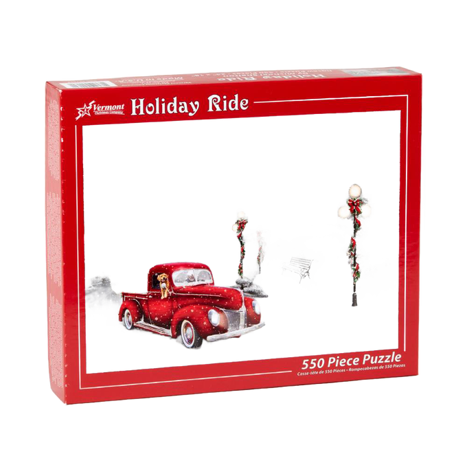 Red vintage pickup truck with a dog in the cab driving through a snowy scene with decorated lampposts and benches, captured on a festive holiday puzzle box for Toys, Books & Games and Puzzles collections.