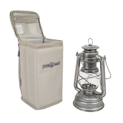 Beige padded nylon carry case with reinforced inlay and zippered pocket, designed for safely transporting lanterns, ideal for camping, emergency supplies, and outdoor lighting.