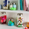 Handcrafted Ball jars with stainless steel lids used for colorful yarn and craft supply storage, showcasing practical decor in Home & Decor, Kitchen & Food, and Storage and Serving collections.