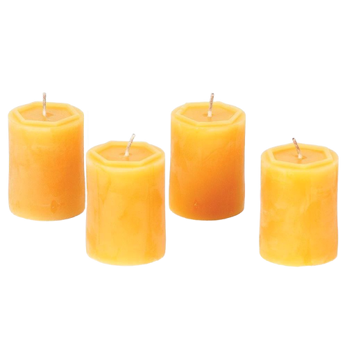 Set of four handcrafted 100 percent beeswax votive candles in warm honey tones, made in USA, offering long burn times and natural, smokeless illumination.