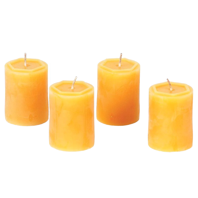 Set of four handcrafted 100 percent beeswax votive candles in warm honey tones, made in USA, offering long burn times and natural, smokeless illumination.
