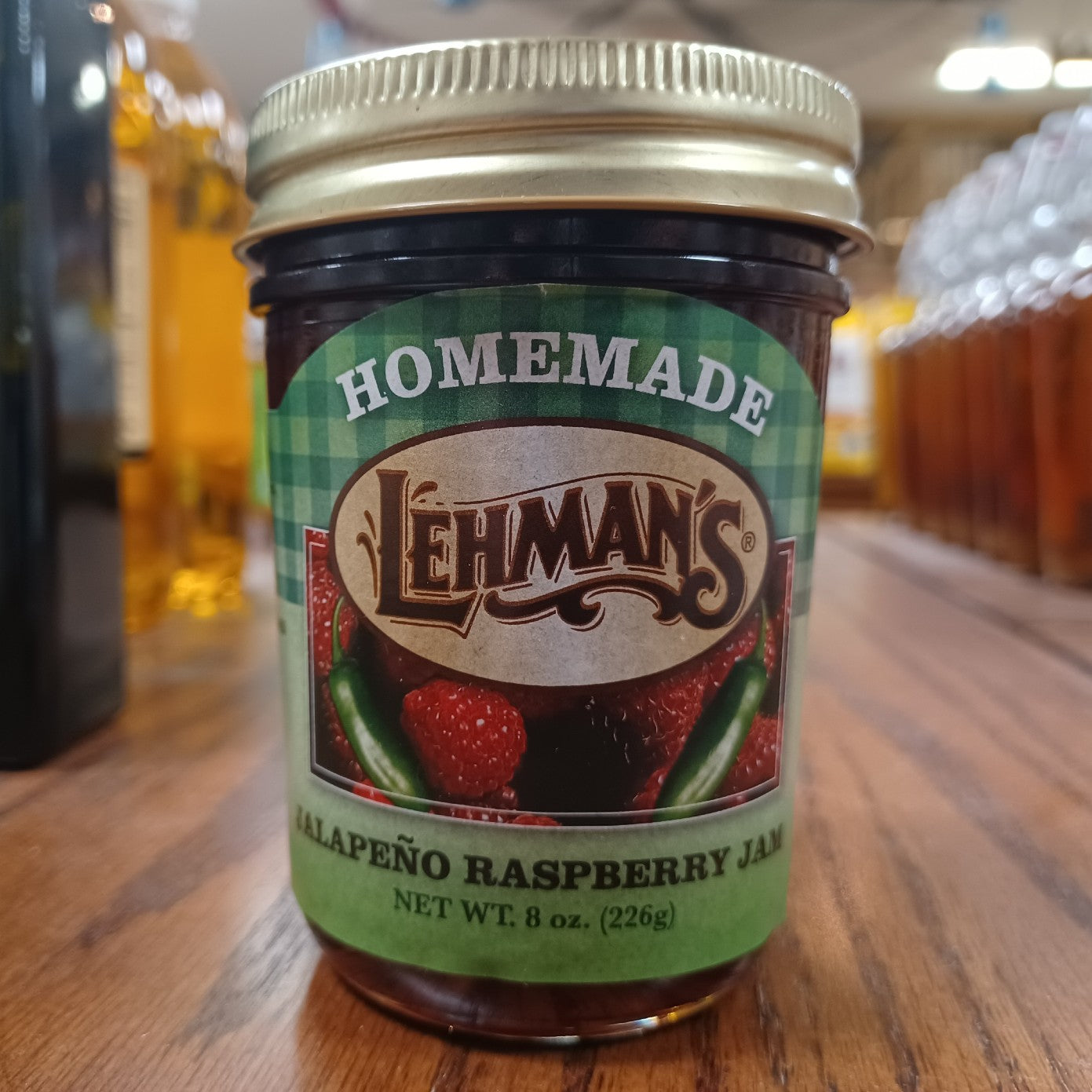 Glass jar of handcrafted Lehman’s Jalapeño Raspberry Jam with all-natural ingredients, Amish made in USA, perfect for Kitchen & Food, Pantry, Peanut Butter & Jellies, USA Made, and Best Sellers collections.