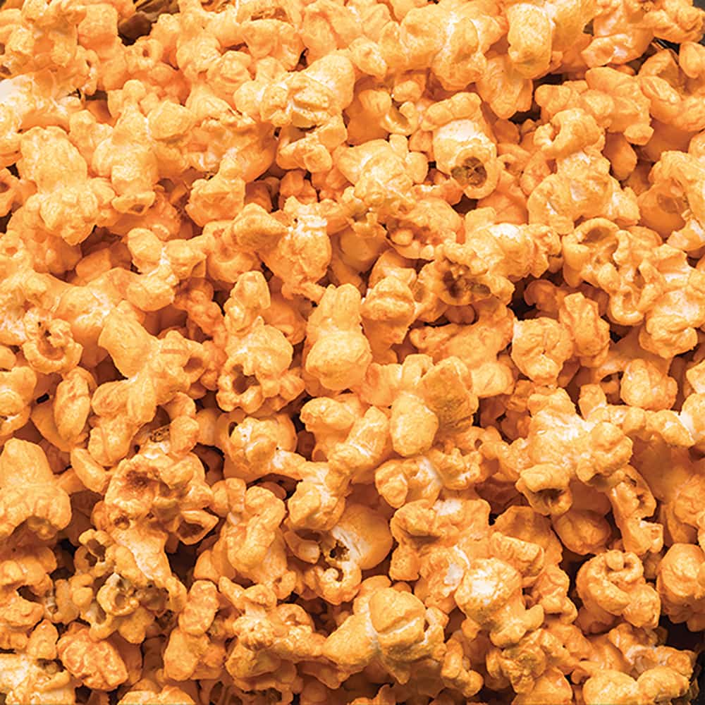 Close-up of handcrafted bacon and cheese flavored popcorn, made in the USA, perfect for Kitchen & Food, Popcorn, and Best Sellers collections.