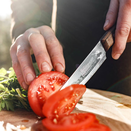 Handcrafted utility knife with a durable high-quality steel blade and robust walnut handle slicing fresh tomato, ideal for Farm, Garden & Tool, Kitchen & Food, Camping, and Food Prep collections.