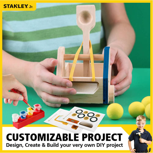 Child holding a wooden truck catapult with yellow rubber bands, paint set with four colors, wheels stickers, and four yellow foam balls, a hands-on DIY toy in Toys, Books & Games and Arts and Crafts collections.